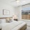 Bedroom with natural lighting and high ceilings