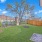 A fenced in yard with grass