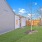 A fenced in yard with grass